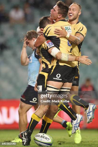Jono Lance of the Force celebrates with his team mateRichard Hardwick of the Force after scoring a try during the round one Super Rugby match between...