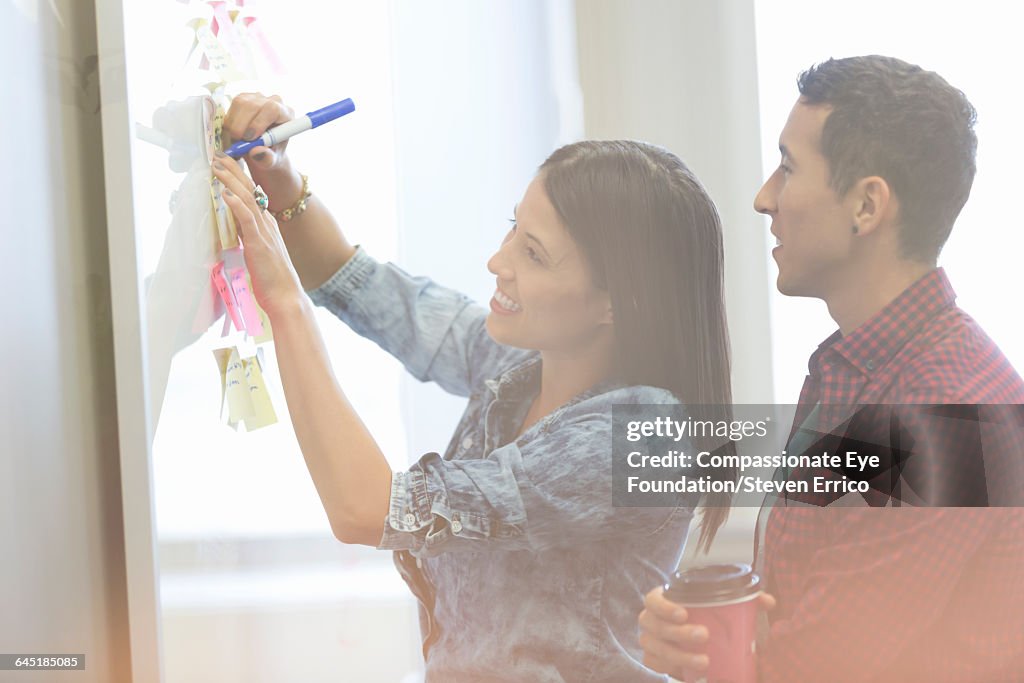Businesswoman discussing project with colleague