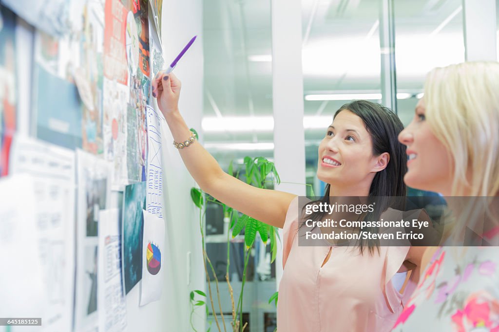 Businesswoman discussing project with colleague