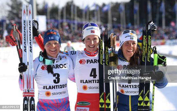 Krista Parmakoski of Finland , Marit Bjoergen of Norway and Charlotte Kalla of Sweden pose after the Women's Cross Country Skiathlon during the FIS...