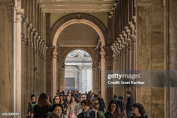 vaulted street and colmuns of via roma - via roma stock pictures, royalty-free photos & images