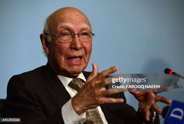 Adviser to the Pakistani Prime Minister on Foreign Affairs, Sartaj Aziz gestures as he briefs media representatives at the foreign office in...