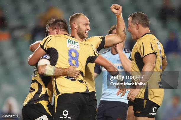 Jono Lance of the Force celebrates with his team mates Richard Hardwick and Bill Meakes of the Force after scoring a try during the round one Super...