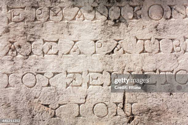 greek lettering in aphrodisias - greek alphabet stock pictures, royalty-free photos & images