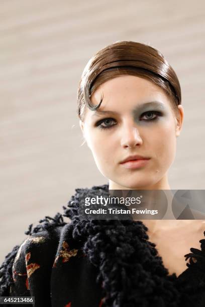 Model prepares backstage ahead of the Antonio Marras show during Milan Fashion Week Fall/Winter 2017/18 on February 25, 2017 in Milan, Italy.