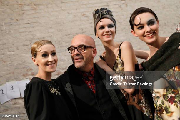 Designer Antonio Marras poses with models backstage ahead of the Antonio Marras show during Milan Fashion Week Fall/Winter 2017/18 on February 25,...