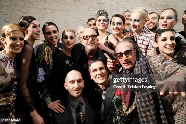 Designer Antonio Marras poses with models backstage ahead of the Antonio Marras show during Milan Fashion Week Fall/Winter 2017/18 on February 25,...