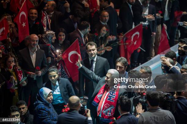 Turkey's Prime Minister Binali Yildirim, waves to the crowd as he arrives at a rally officially opening the AKP Party "Yes" constitutional referendum...