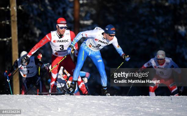 Alex Harvey of Canada and Matti Heikkinen of Finland compete in the Men's Cross Country Skiathlon during the FIS Nordic World Ski Championships on...