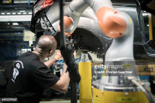 Mechanic during the assembly of a Ford Fiesta at the Ford plant in Cologne-Niehl on February 15, 2017 in Cologne, Germany.