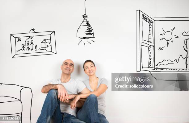 couple day dreaming - dreaming of home ownership stock pictures, royalty-free photos & images