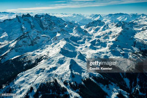 austrian alps in winter seen from plane - wildnis stock pictures, royalty-free photos & images