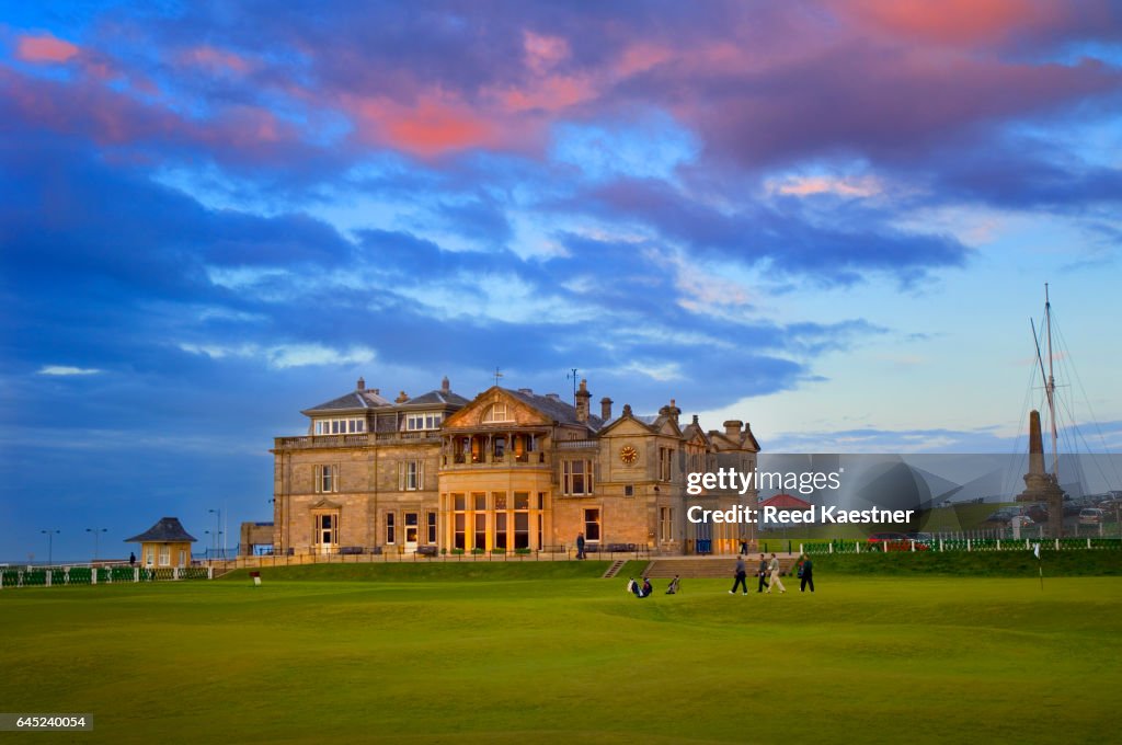 Late evening light illuminates the R&A "clubhouse" at St Andrews overlooking the 18th green on the "Old Course"