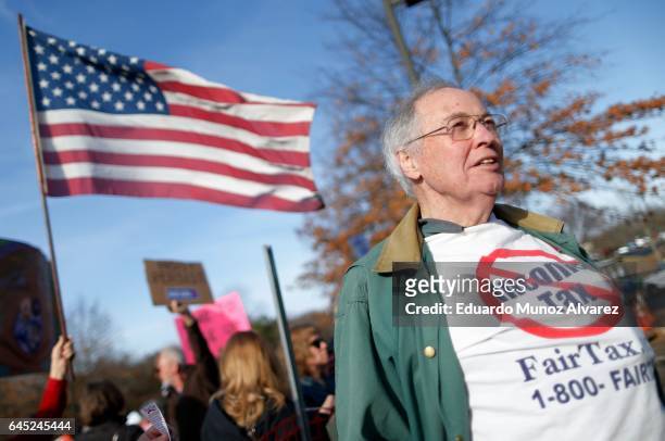 People take part in a protest outside of the Edward Nash Theater on the campus of Raritan Valley Community College where GOP Rep. Leonard Lance is...