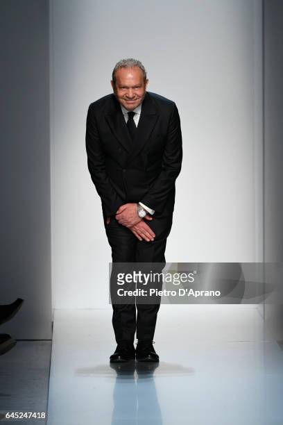 Designer Ermanno Scervino acknowledges the applause of the public after the runway at the Ermanno Scervino show during Milan Fashion Week Fall/Winter...