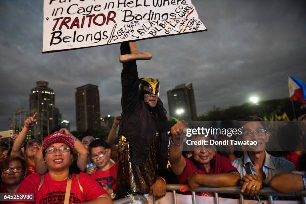 Thousands of pro-Duterte supporters cheer during a vigil rally in support of President Rodrigo Duterte's anti-drug campaign which also coincided with...