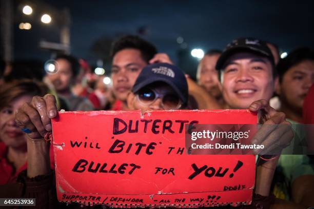 Thousands of pro-Duterte supporters cheer during a vigil rally in support of President Rodrigo Duterte's anti-drug campaign which also coincided with...