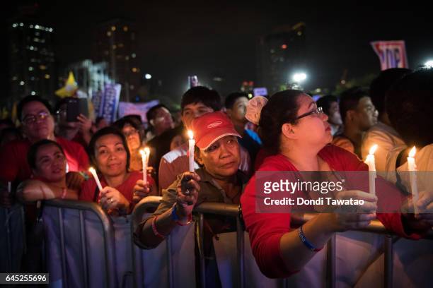 Thousands of pro-Duterte supporters cheer during a vigil rally in support of President Rodrigo Duterte's anti-drug campaign which also coincided with...