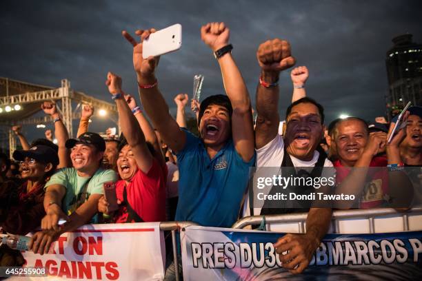 Thousands of pro-Duterte supporters cheer during a vigil rally in support of President Rodrigo Duterte's anti-drug campaign which also coincided with...