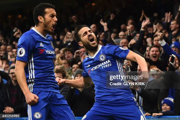 Chelsea's Spanish midfielder Cesc Fabregas and Chelsea's Spanish midfielder Pedro celebrate after Fabregas scored the opening goal during the English...