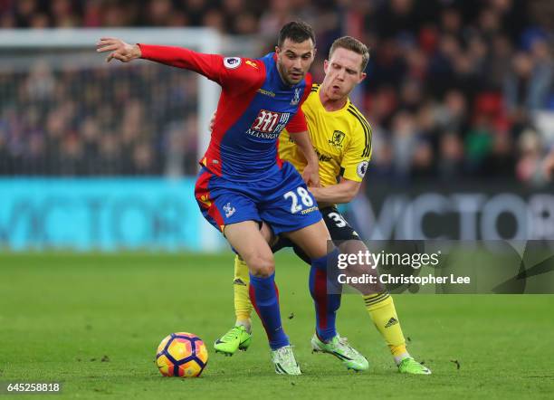 Luka Milivojevic of Crystal Palace is put under pressure from Adam Forshaw of Middlesbrough during the Premier League match between Crystal Palace...