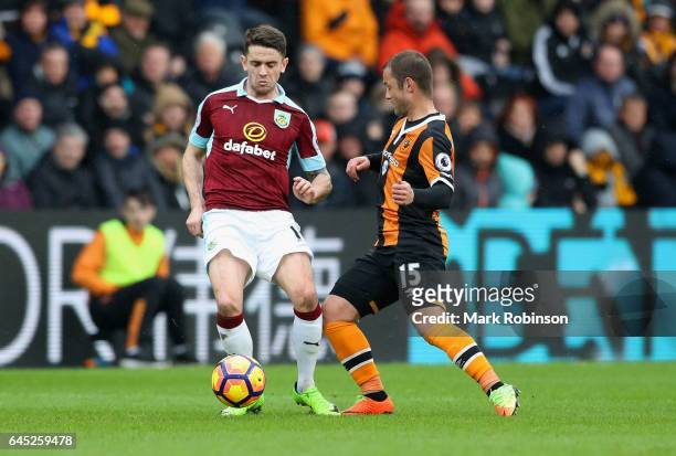 Robbie Brady of Burnley and Shaun Maloney of Hull City battle for possession during the Premier League match between Hull City and Burnley at KCOM...