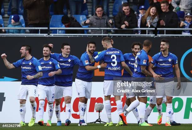 Marcel Heller of Darmstadt celebrates his team's first goal with team mates during the Bundesliga match between SV Darmstadt 98 and FC Augsburg at...