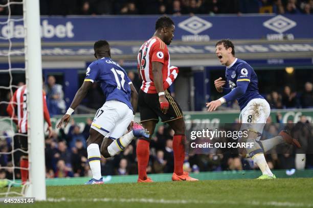 Everton's Senegalese midfielder Idrissa Gueye celebrates scoring the opening goal with Everton's English midfielder Ross Barkley during the English...