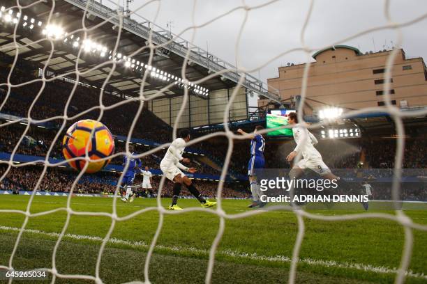 Swansea City's Spanish striker Fernando Llorente scores an equalising goal for 1-1 during the English Premier League football match between Chelsea...