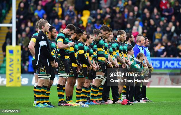 Players of Northampton Saints line up for a minutes silence of respect for the passing of former player Dan Vickerman during the Aviva Premiership...