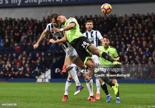 Craig Dawson of West Bromwich Albion and Tyrone Mings of AFC Bournemouth battle to win a header during the Premier League match between West Bromwich...