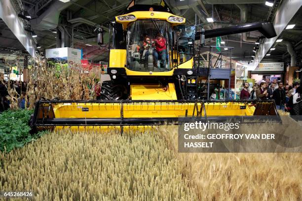 Picture taken on February 25, 2017 shows a tractor on display during the opening day of the Paris international agricultural fair at the Porte de...