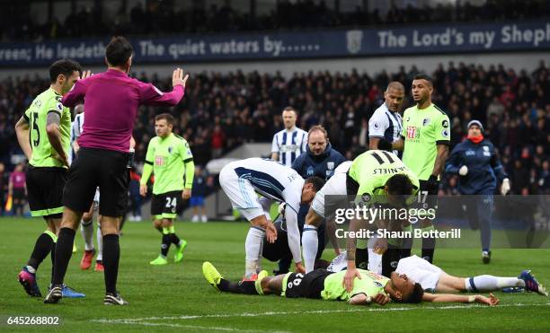 Charlie Daniels of AFC Bournemouth checks if his team mate Tyrone Mings of AFC Bournemouth is okay during the Premier League match between West...