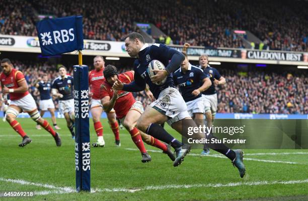 Tim Visser of Scotland runs in his team's second try during the RBS Six Nations match between Scotland and Wales at Murrayfield Stadium on February...