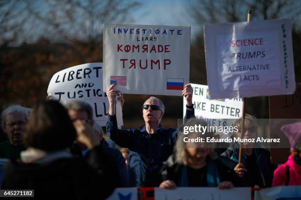 People take part in a protest outside of the Edward Nash Theater on the campus of Raritan Valley Community College where GOP Rep. Leonard Lance is...