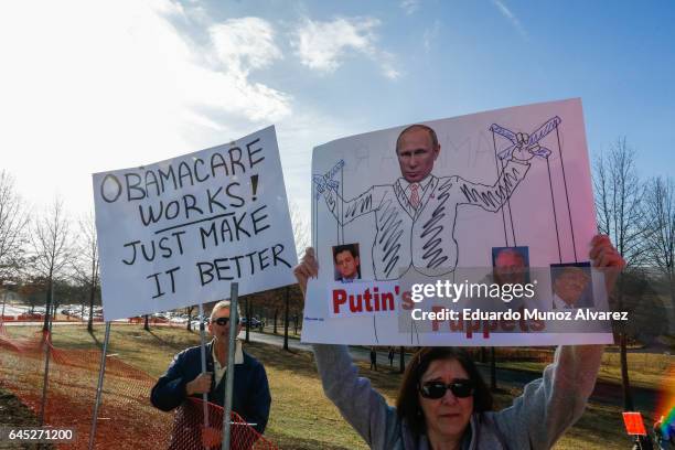 People take part in a protest outside of the Edward Nash Theater on the campus of Raritan Valley Community College where GOP Rep. Leonard Lance is...