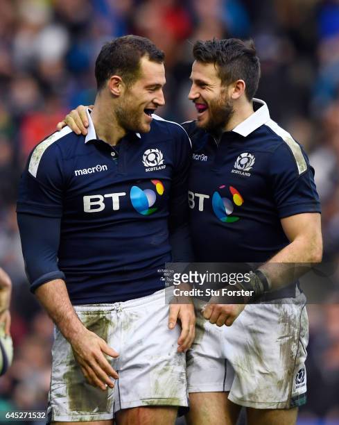 Tim Visser of Scotland is congratulated by teammate Tommy Seymour after scoring his team's second try during the RBS Six Nations match between...