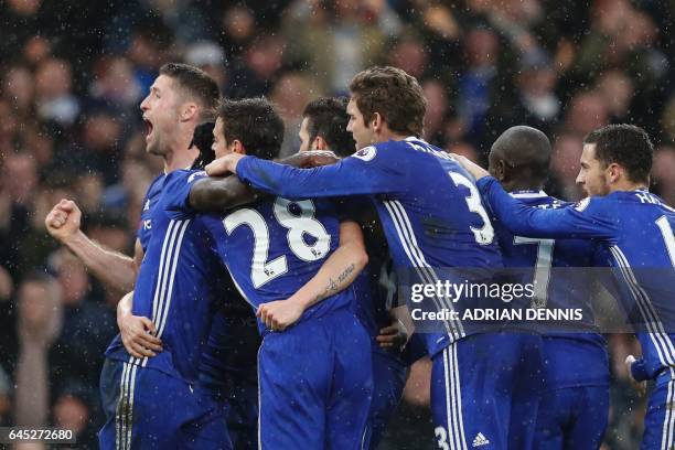 Chelsea players including Chelsea's English defender Gary Cahill celebrate their second goal scored by Chelsea's Spanish midfielder Pedro during the...