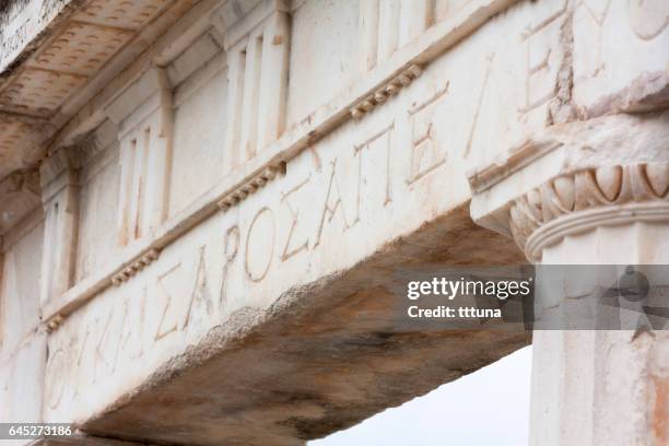 griechische schrift in aphrodisias - ancient greek alphabet stock-fotos und bilder