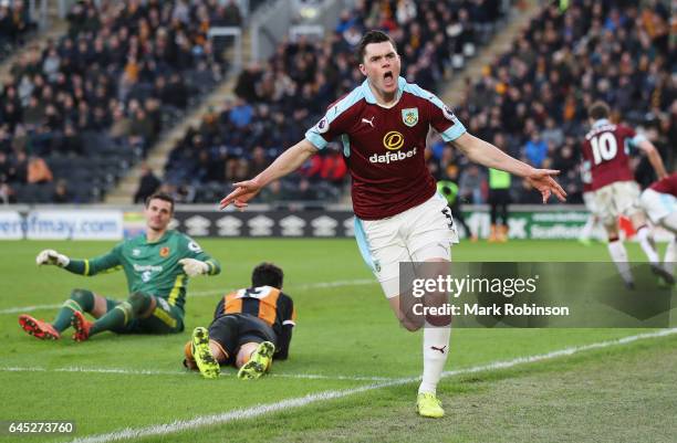 Michael Keane of Burnley celebrates scoring his sides first goal during the Premier League match between Hull City and Burnley at KCOM Stadium on...