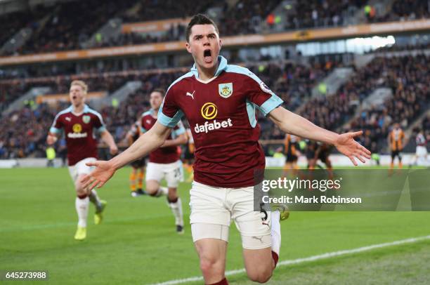 Michael Keane of Burnley celebrates scoring his sides first goal during the Premier League match between Hull City and Burnley at KCOM Stadium on...