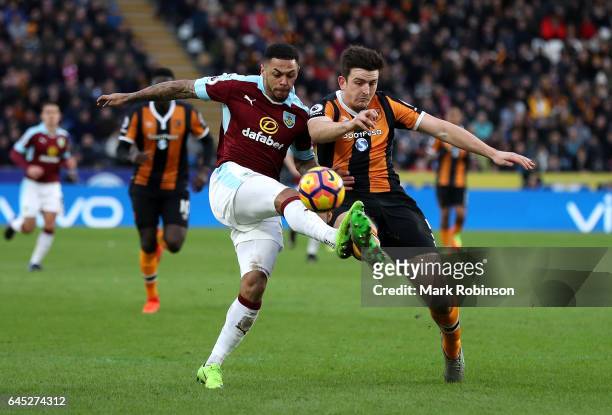 Andre Gray of Burnley and Harry Maguire of Hull City battle for possession during the Premier League match between Hull City and Burnley at KCOM...