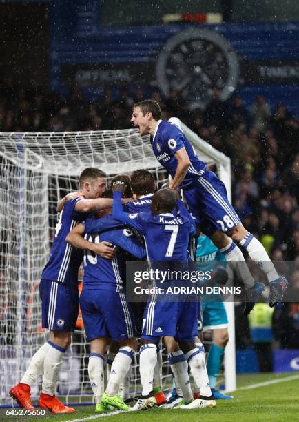 Chelsea's Spanish defender Cesar Azpilicueta jumps in to join the celebration after Chelsea's Brazilian-born Spanish striker Diego Costa scored their...