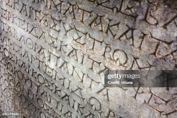 greek lettering in aphrodisias - ancient roman alphabet stock pictures, royalty-free photos & images