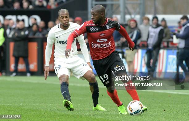 Guingamp's French forward Yannis Salibur outruns Monaco's French defender Djibril Sidibe during the French L1 football match Guingamp vs Monaco on...