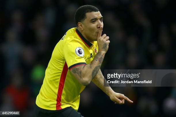 Troy Deeney of Watford celebrates as he scores the first goal from a penalty during the Premier League match between Watford and West Ham United at...