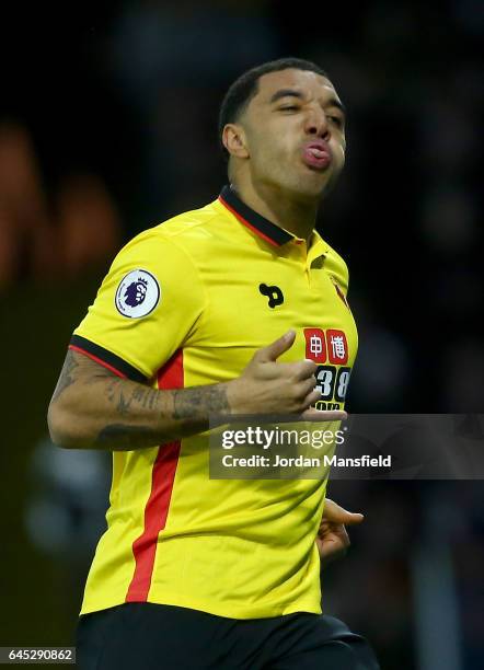 Troy Deeney of Watford celebrates as he scores the first goal from a penalty during the Premier League match between Watford and West Ham United at...