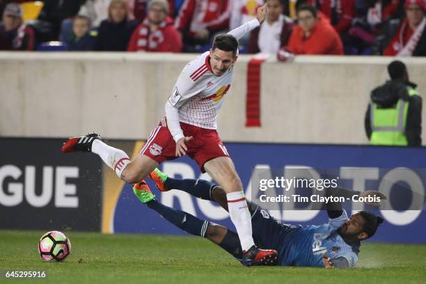 Sacha Kljestan of New York Red Bulls is challenged by Sheanon Williams of Vancouver Whitecaps during the New York Red Bulls Vs Vancouver Whitecaps FC...