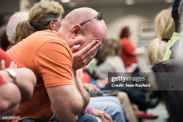 Man reacts during a town hall meeting with Sen. Tim Scott , at the Charleston County Council Chambers on February 25, 2017 in North Charleston, South...