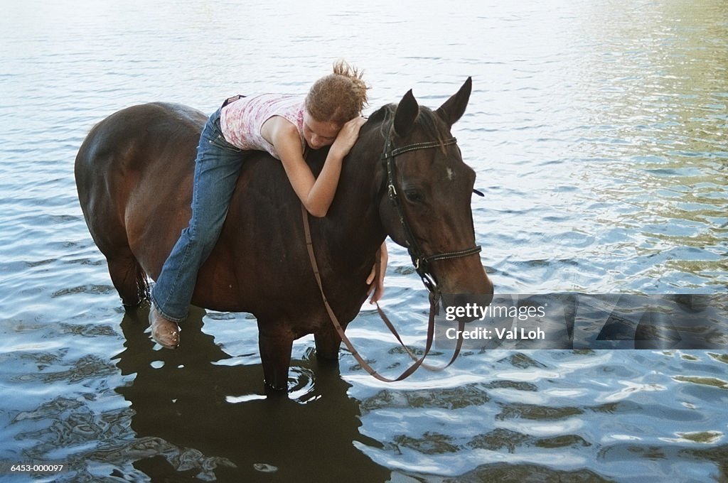 Girl Riding Horse in Water